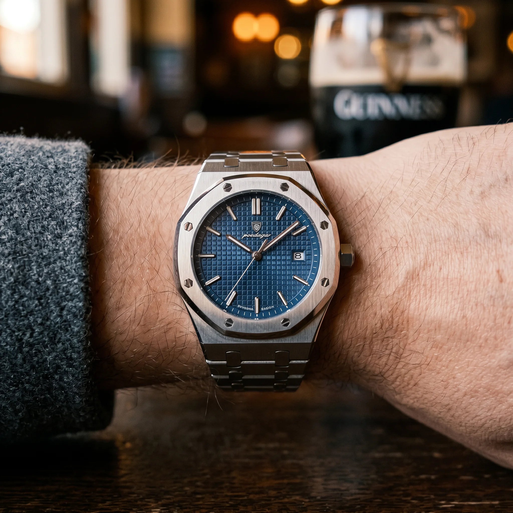 Kron Mariner watch on wrist, Dublin pub interior, top-down view