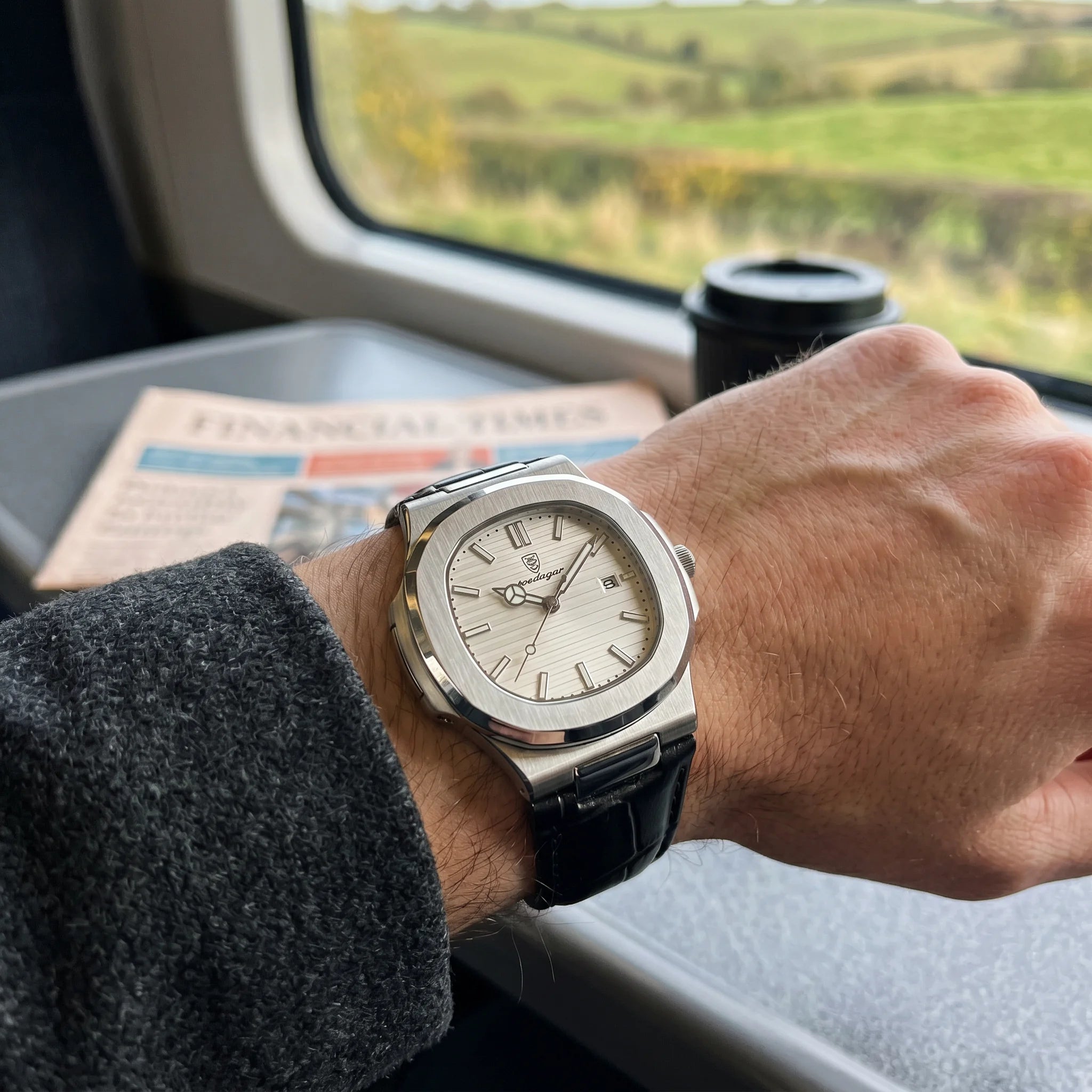 Kron Atlas watch on wrist, British rail train carriage, back of hand view