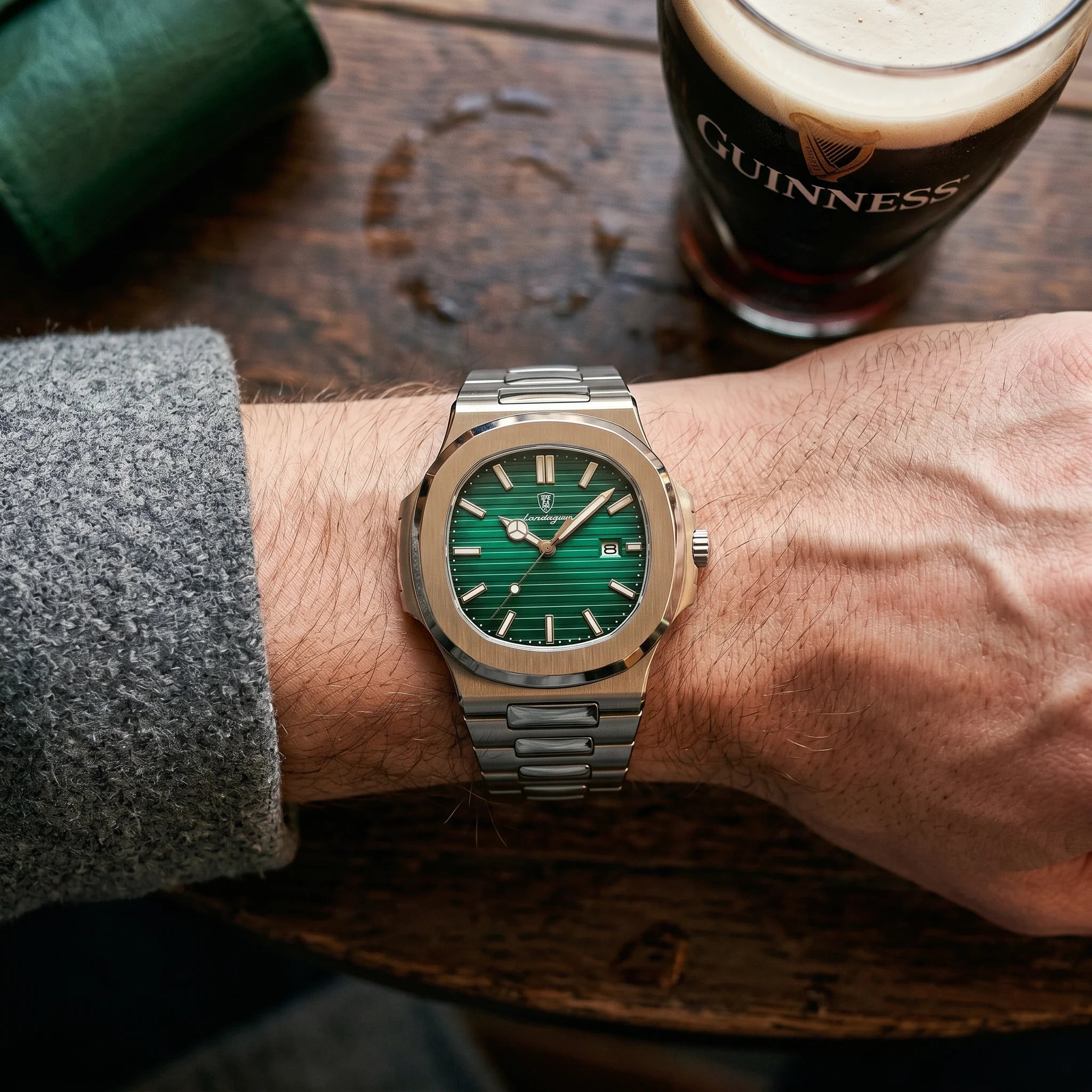 Kron Caspian watch on wrist, Dublin pub interior, top-down view